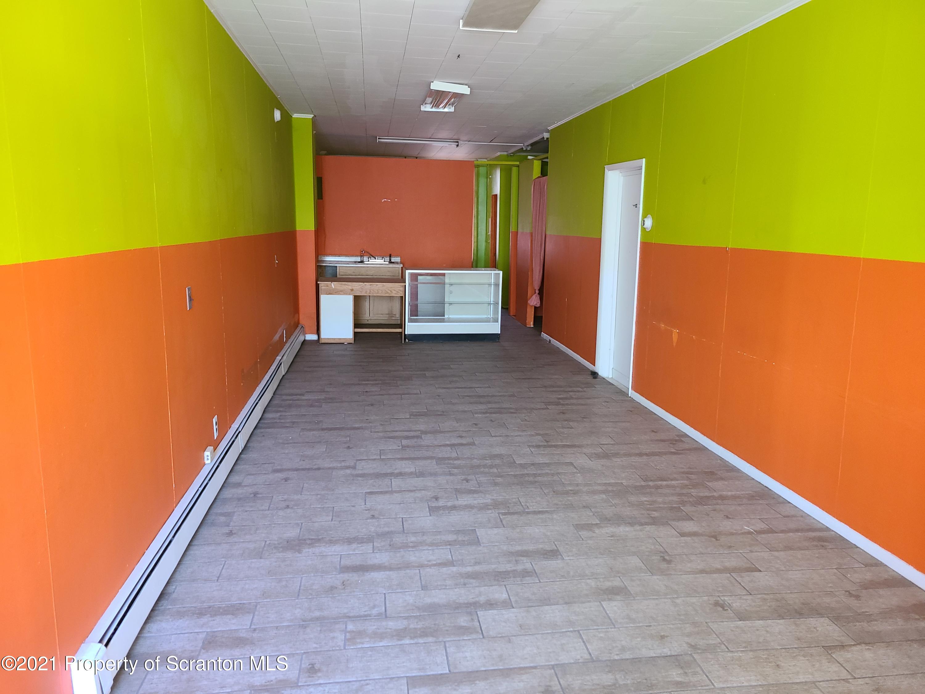 108 North Main Street Scranton, PA 18517 - Photo 8 of 16 a view of an empty room with a window