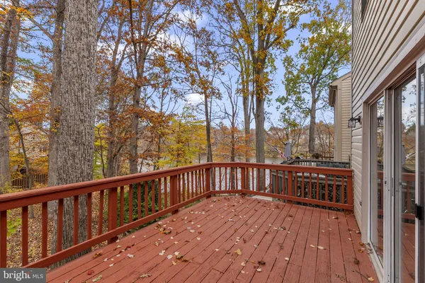 a view of a wooden deck with a trees