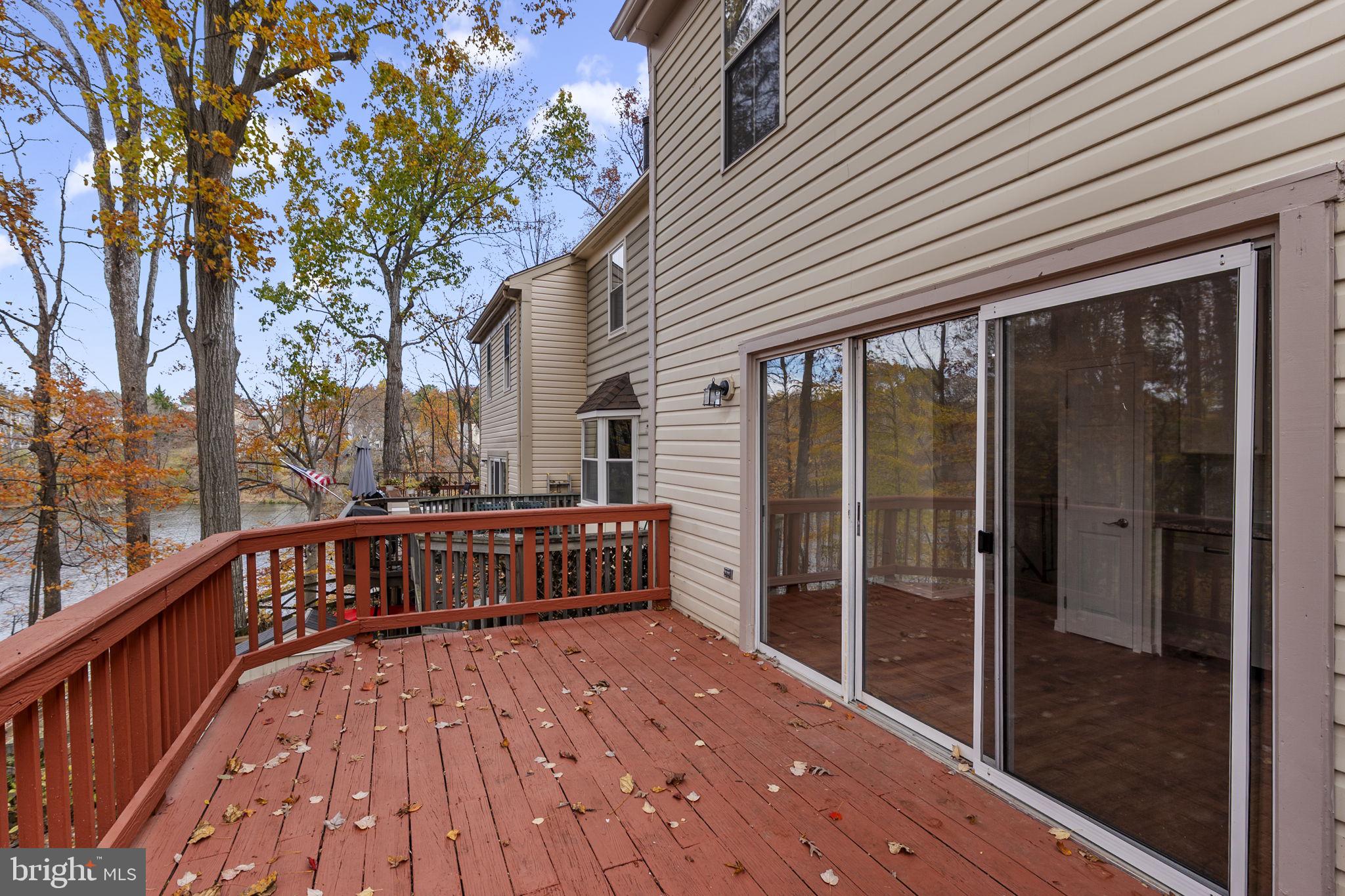 4 Waterside Court Germantown, MD 20874 - Photo 13 of 37 a view of backyard with a deck and wooden floor