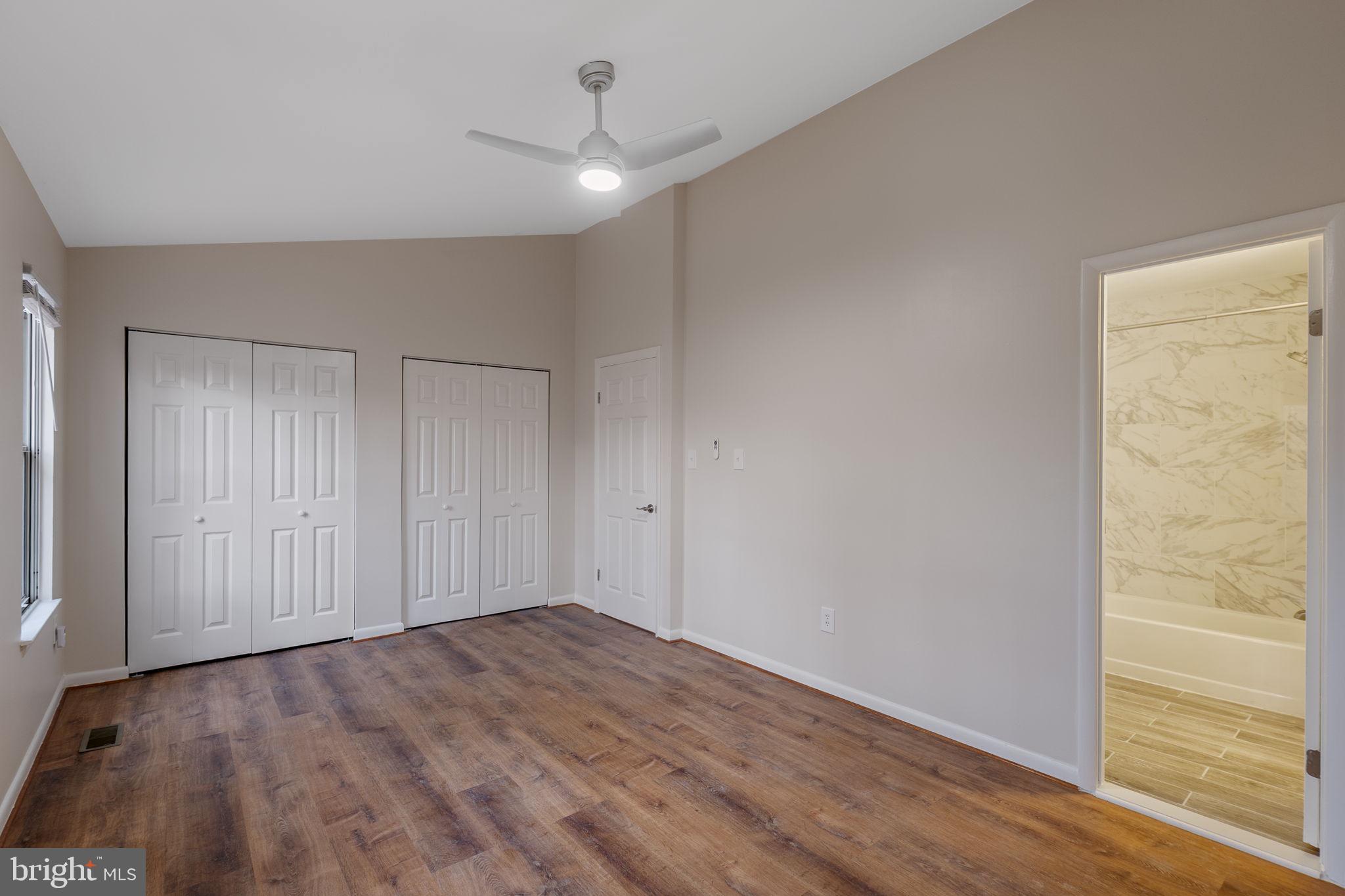 4 Waterside Court Germantown, MD 20874 - Photo 18 of 37 a view of an empty room with wooden floor