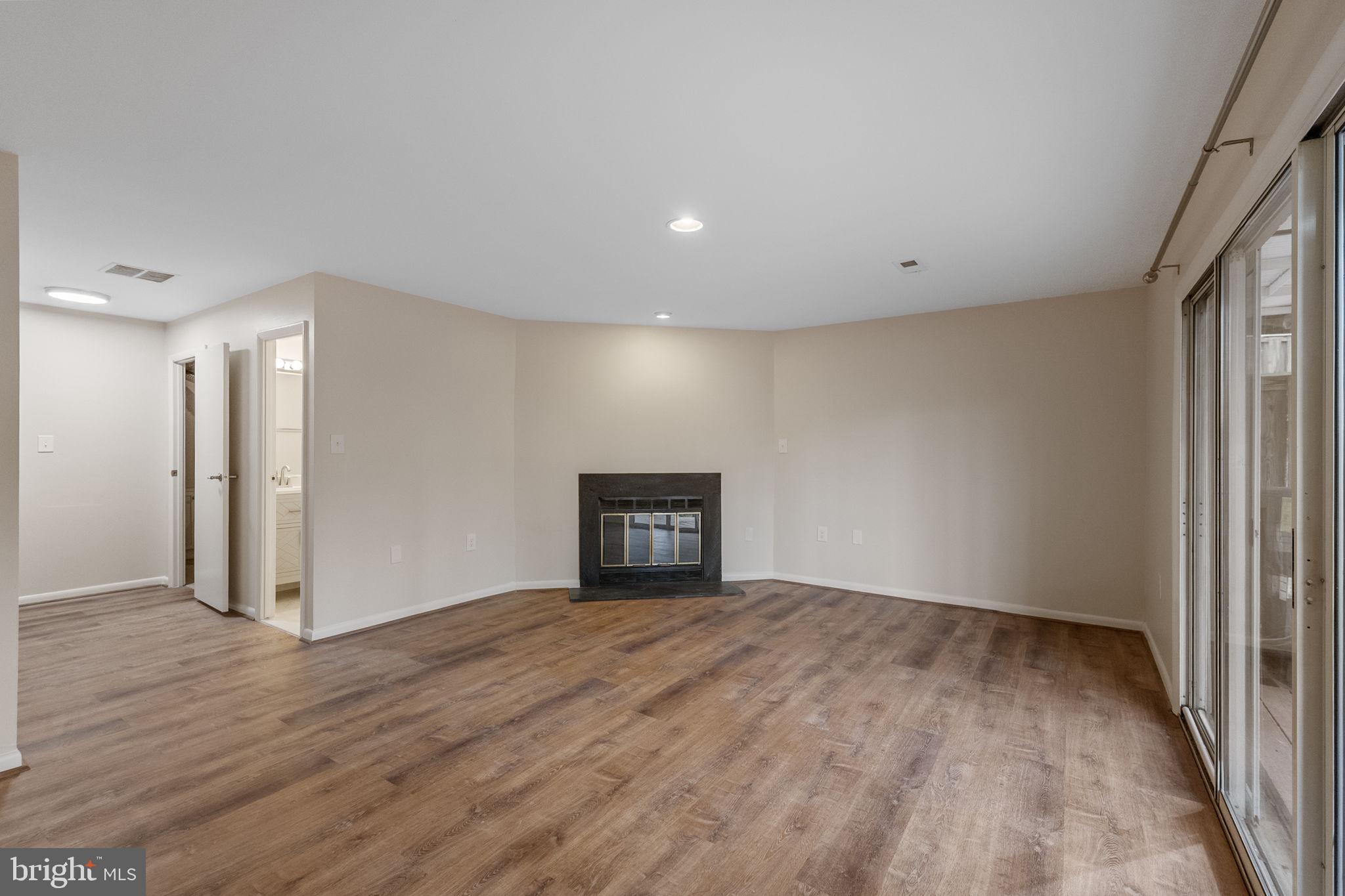 4 Waterside Court Germantown, MD 20874 - Photo 26 of 37 a view of empty room with wooden floor
