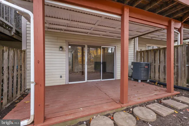 a view of a house with a large window and yard