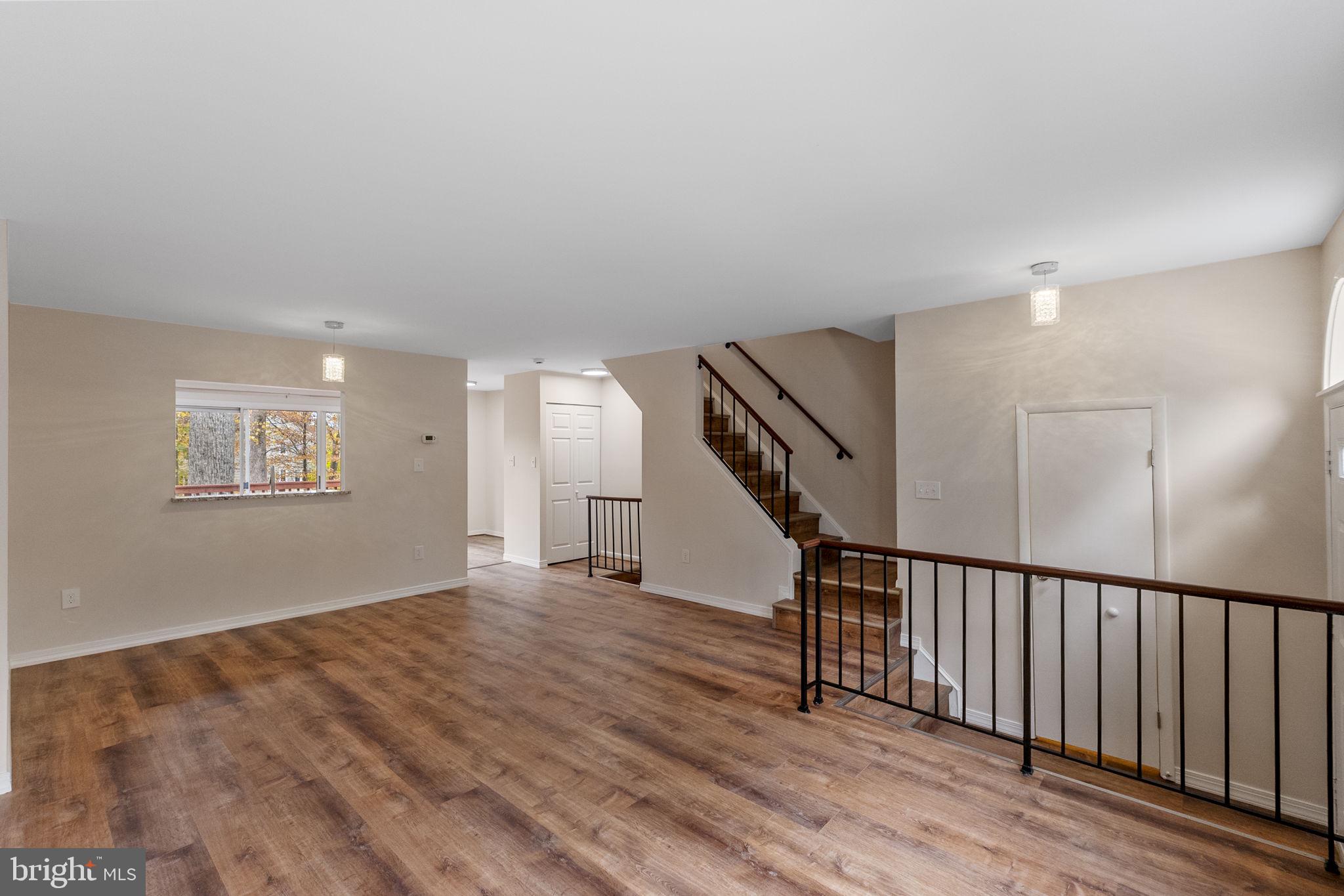 4 Waterside Court Germantown, MD 20874 - Photo 3 of 37 a view of an entryway with wooden floor