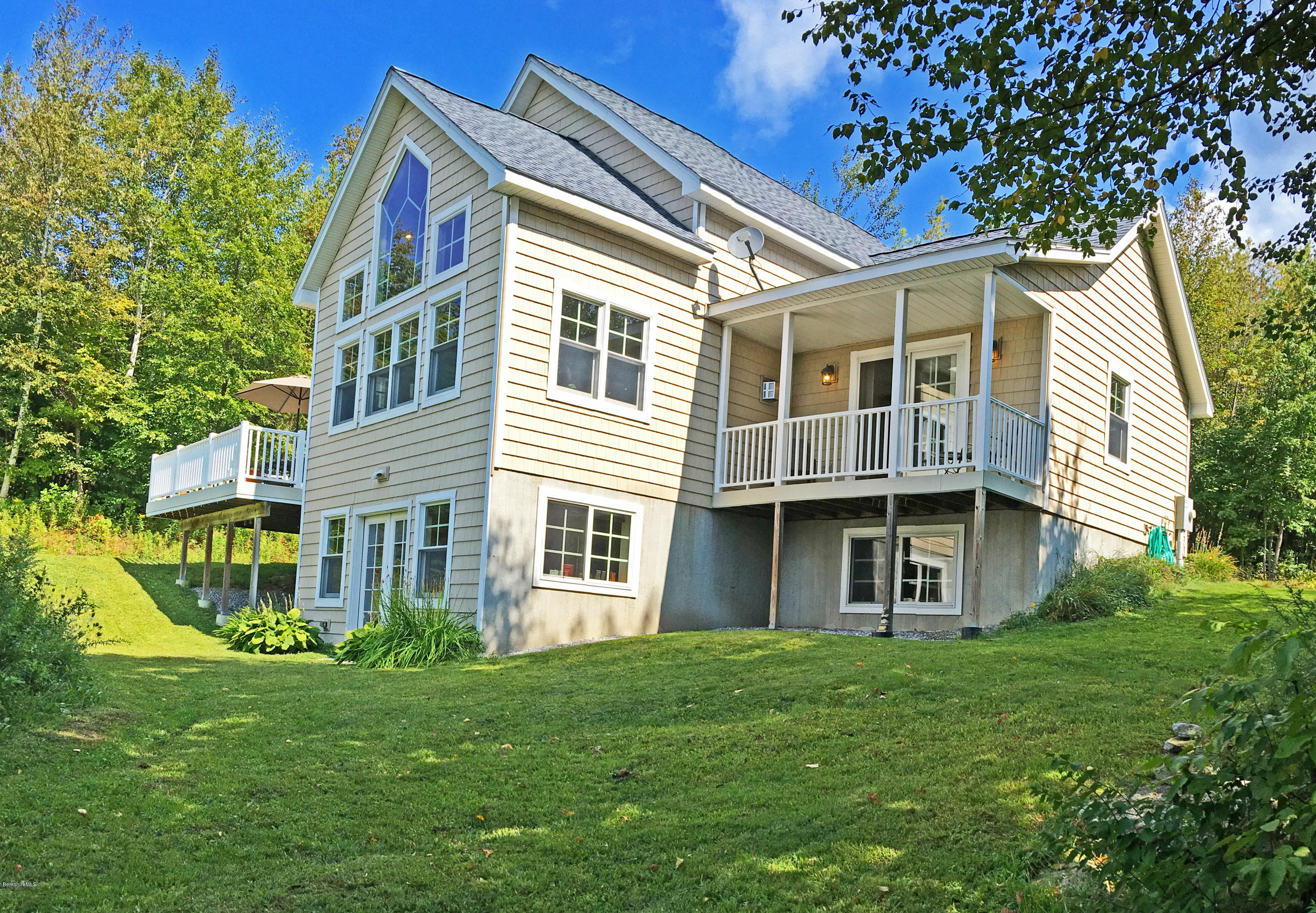 93 Stebbins Road Otis, MA 01253 - Photo 1 of 41 a view of a house with a yard