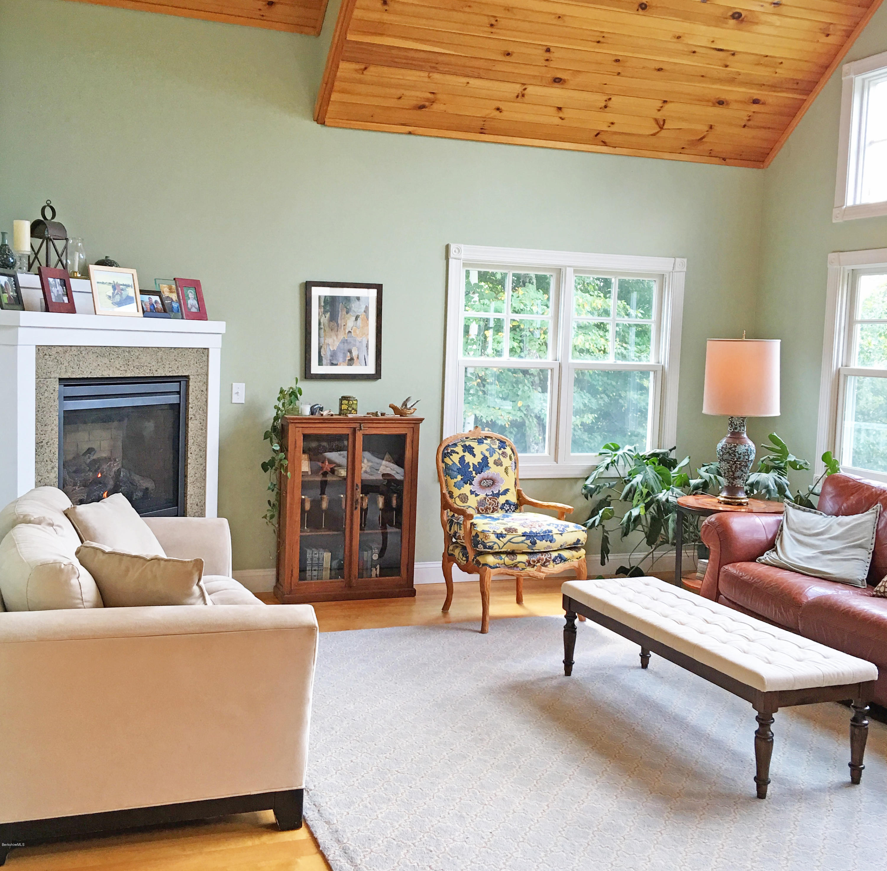 93 Stebbins Road Otis, MA 01253 - Photo 15 of 41 a living room with furniture a fireplace and a window
