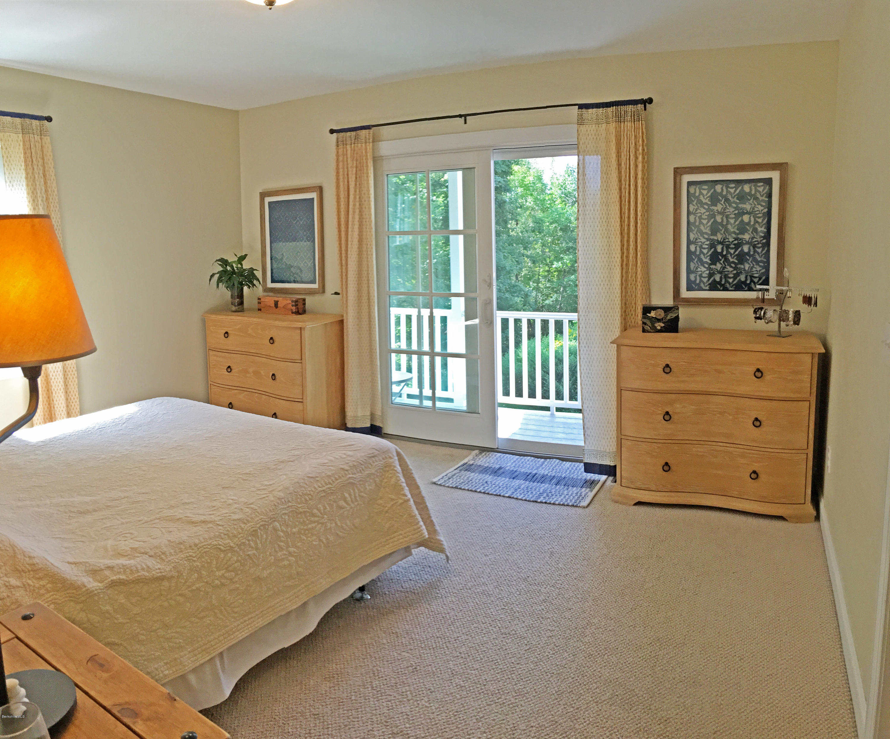 93 Stebbins Road Otis, MA 01253 - Photo 20 of 41 a spacious bedroom with a bed and a dresser