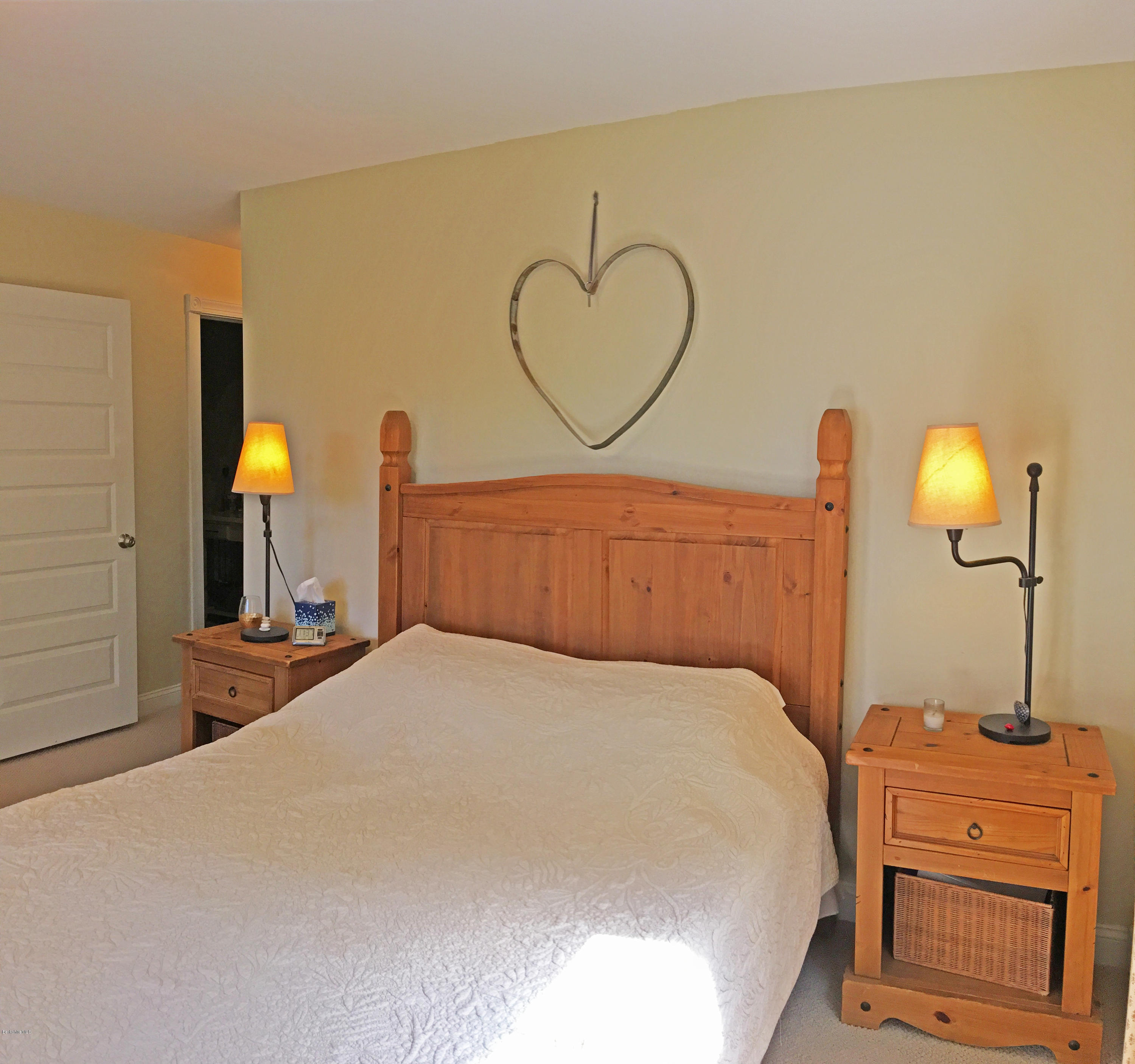 93 Stebbins Road Otis, MA 01253 - Photo 21 of 41 a bedroom with a bed and dresser with mirror