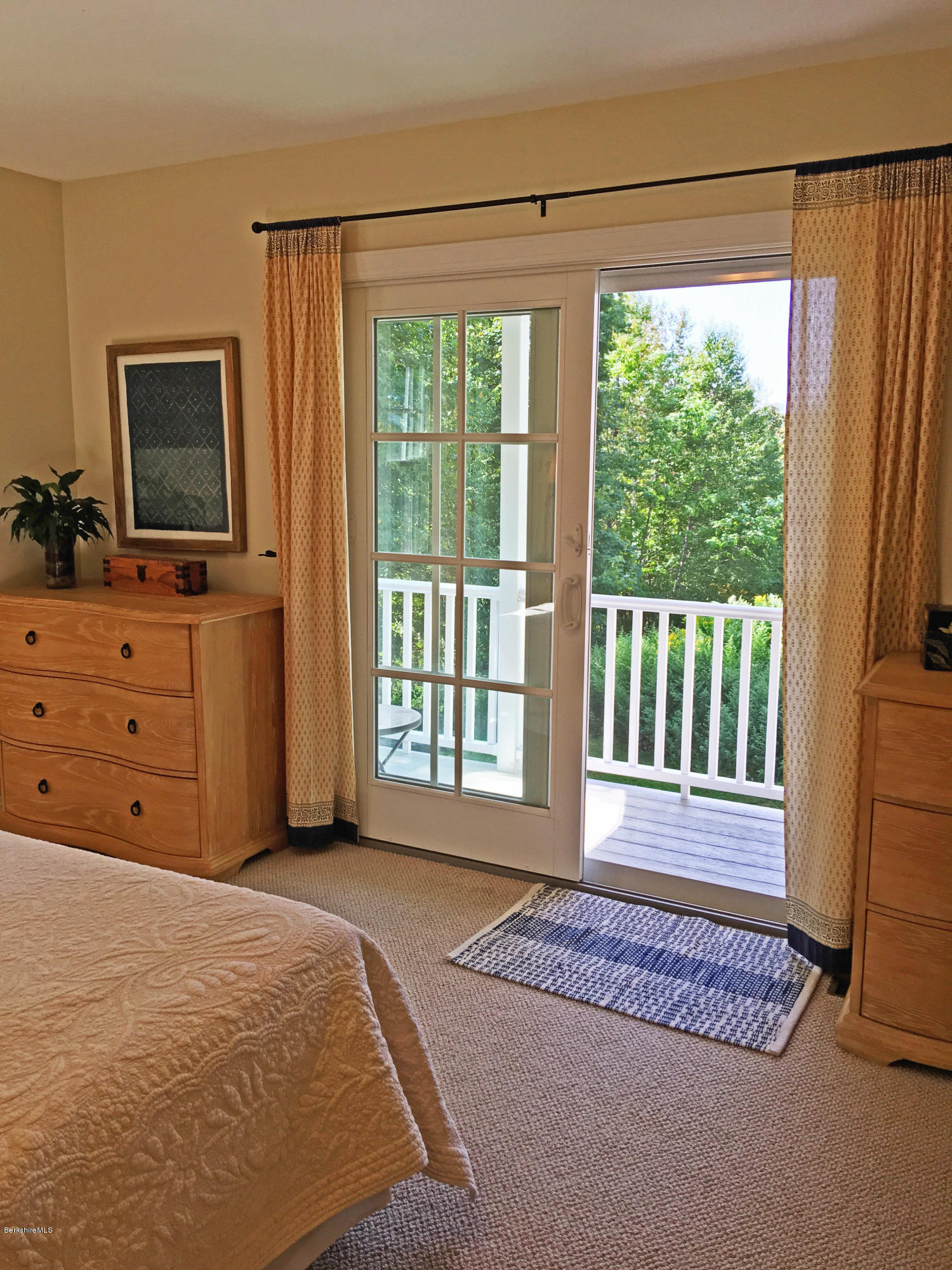 93 Stebbins Road Otis, MA 01253 - Photo 22 of 41 a spacious bedroom with a large bed and a flat tv screen on dresser