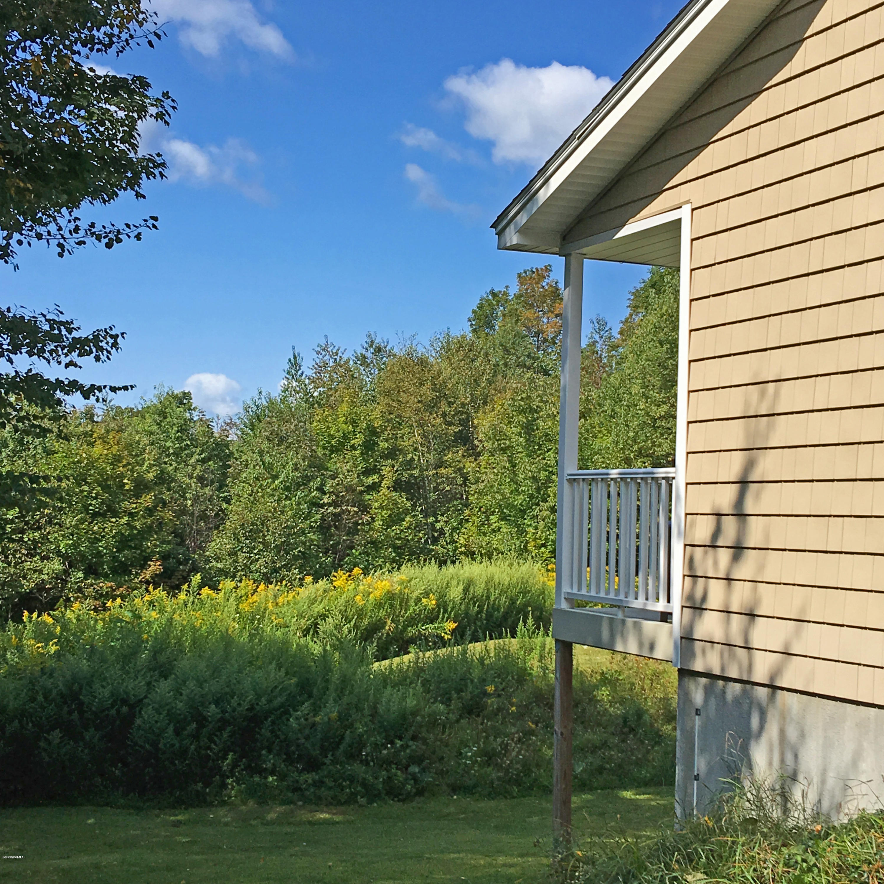 93 Stebbins Road Otis, MA 01253 - Photo 23 of 41 a view of a house with a yard