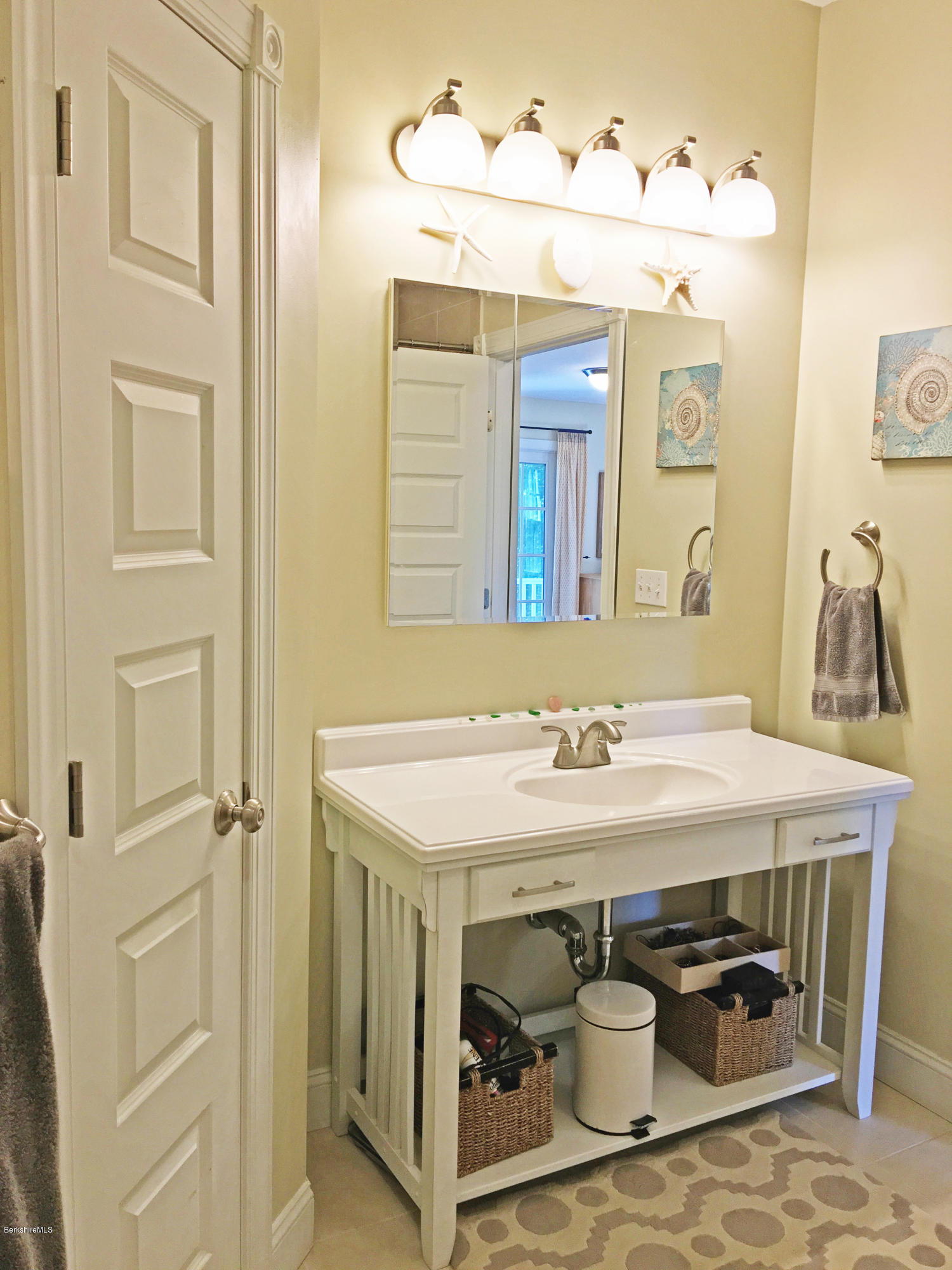 93 Stebbins Road Otis, MA 01253 - Photo 24 of 41 a bathroom with a sink and a mirror
