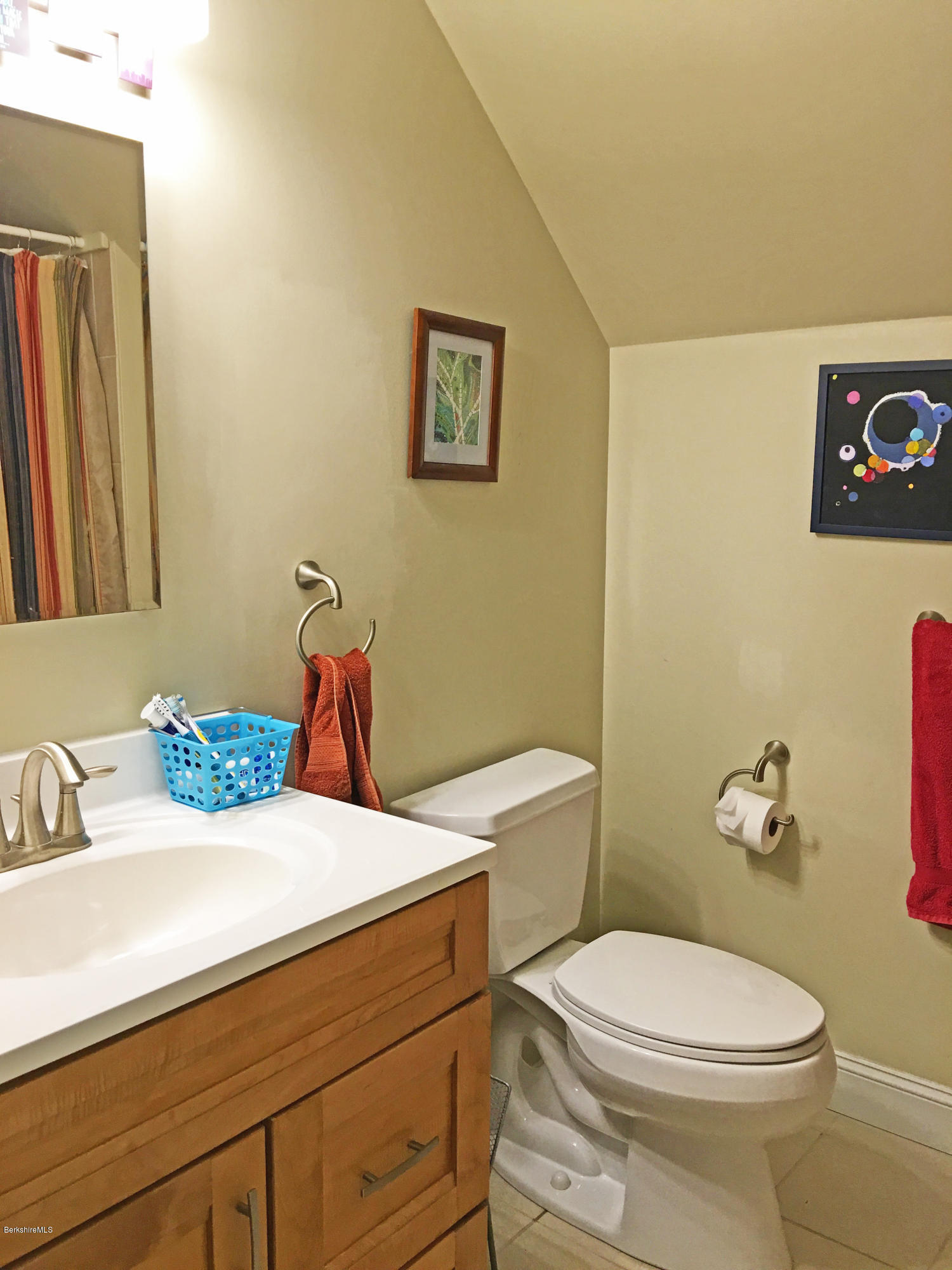 93 Stebbins Road Otis, MA 01253 - Photo 28 of 41 a bathroom with a sink a toilet and a mirror