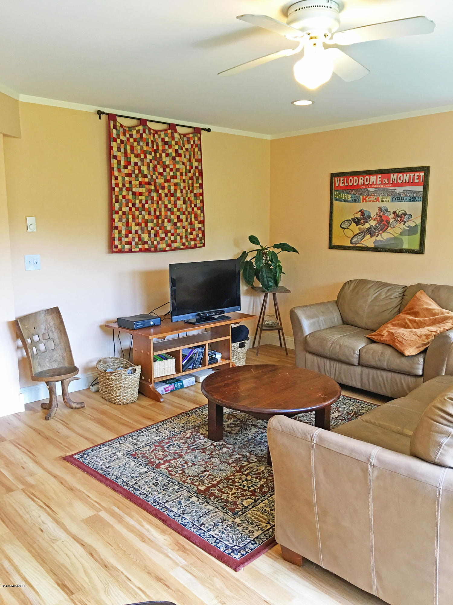 93 Stebbins Road Otis, MA 01253 - Photo 30 of 41 a living room with furniture and a flat screen tv
