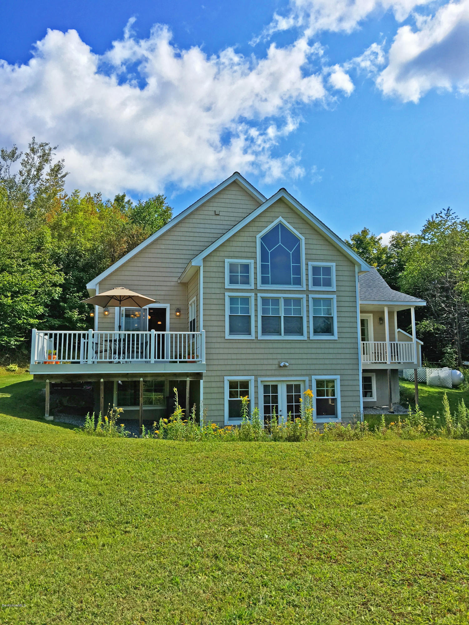 93 Stebbins Road Otis, MA 01253 - Photo 36 of 41 a front view of a house with a garden
