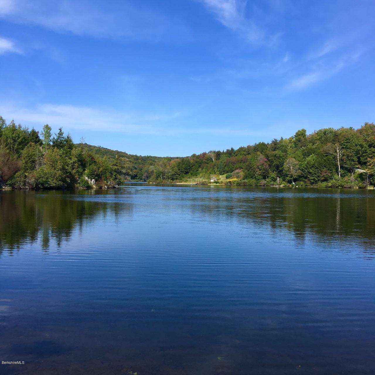 93 Stebbins Road Otis, MA 01253 - Photo 41 of 41 a view of a lake with houses in the back