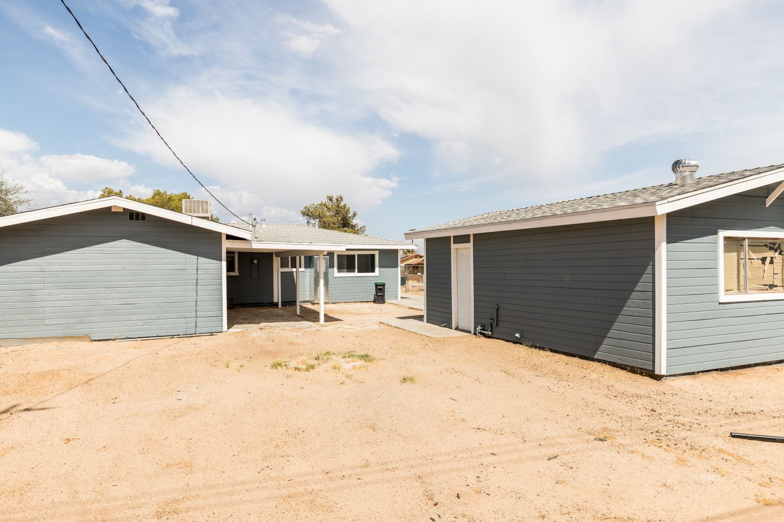 927 West Sullivan Avenue Ridgecrest, CA 93555 - Photo 24 of 24 a front view of a house with a yard