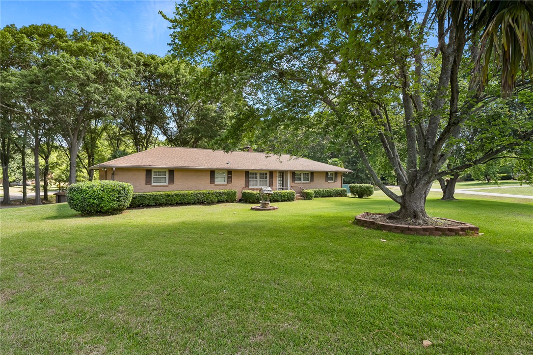 2101 Old Spring Drive Anderson, SC 29625 - Photo 1 of 36 A well-maintained lawn and mature trees frame this classic brick-front home with neatly trimmed hedges.