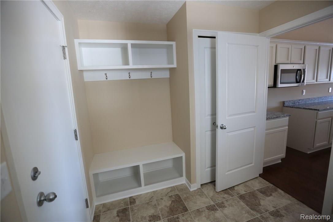 485 Hosta, Unit 86 Howell, MI 48843 - Photo 5 of 11 Please note, pictures are of a different condominium with identical floor plan!