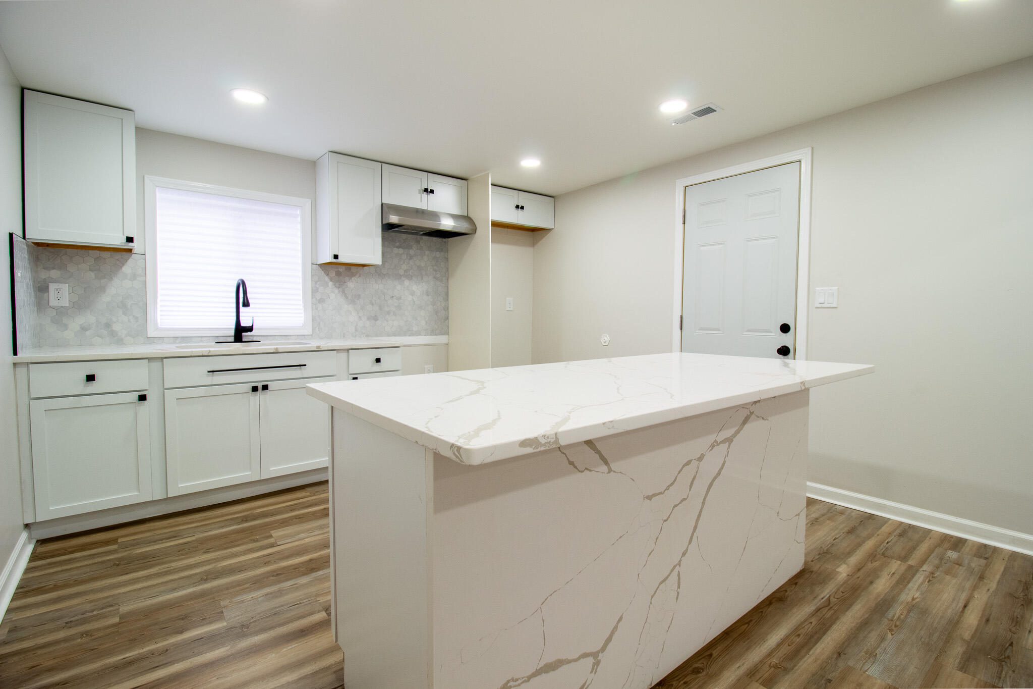 1755 Ralston Street Gary, IN 46406 - Photo 12 of 29 a view of a kitchen sink cabinets and wooden floor