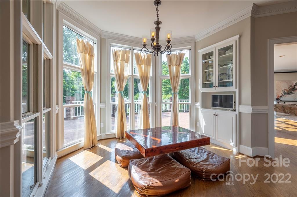 3674 River Road Hickory, NC 28602 - Photo 13 of 48 a living room with furniture and a floor to ceiling windows