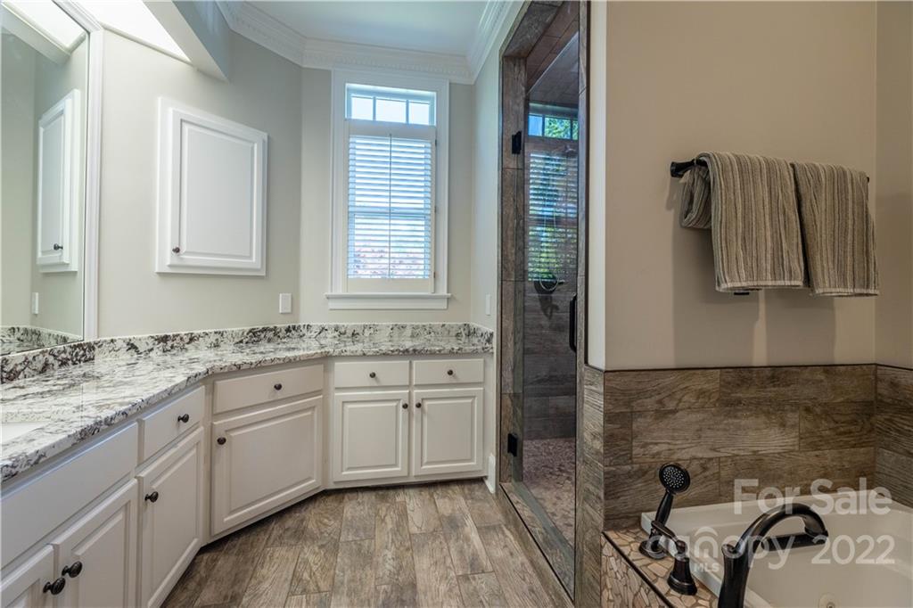 3674 River Road Hickory, NC 28602 - Photo 17 of 48 a spacious bathroom with a sink and a mirror