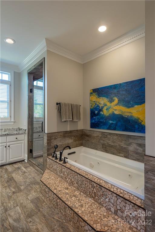 3674 River Road Hickory, NC 28602 - Photo 19 of 48 a spacious bathroom with a granite countertop sink a mirror and a bathtub