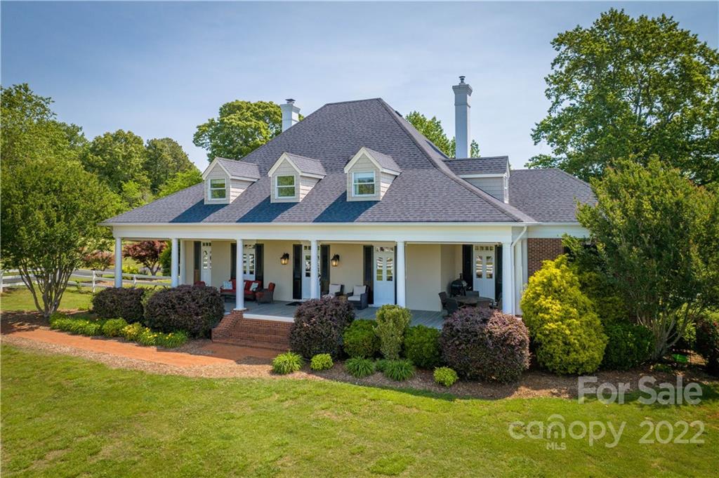 3674 River Road Hickory, NC 28602 - Photo 2 of 48 a front view of a house with a garden