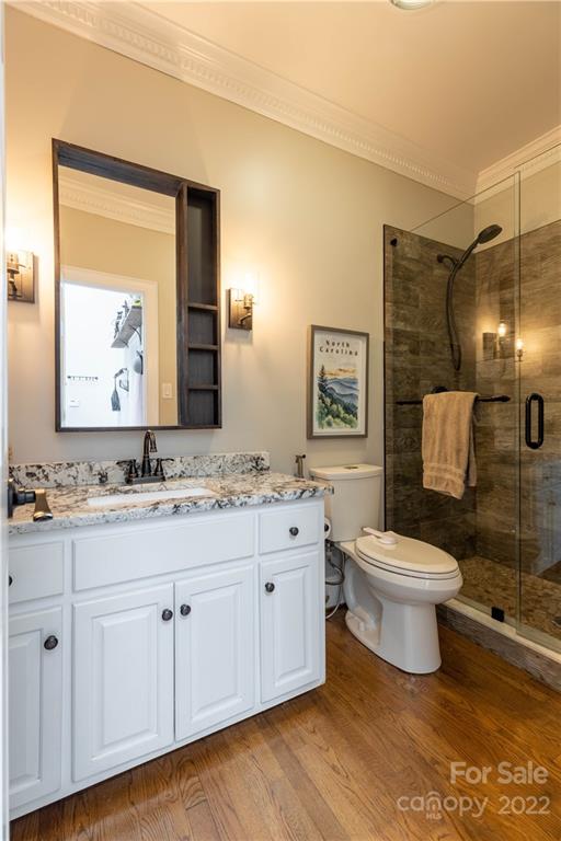 3674 River Road Hickory, NC 28602 - Photo 23 of 48 a bathroom with a toilet a sink and mirror