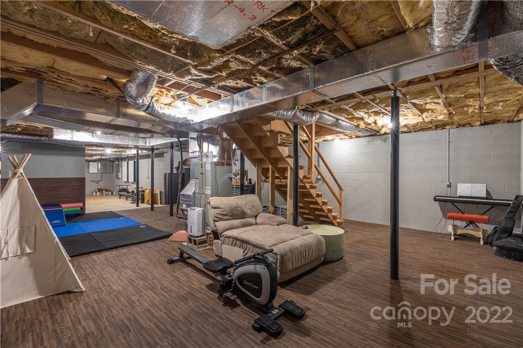 3674 River Road Hickory, NC 28602 - Photo 30 of 48 a living room with furniture and a table