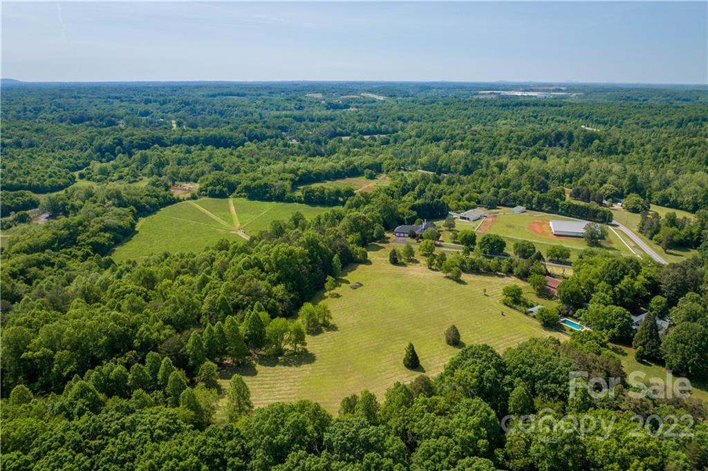 3674 River Road Hickory, NC 28602 - Photo 36 of 48 an aerial view of residential houses with outdoor space and trees