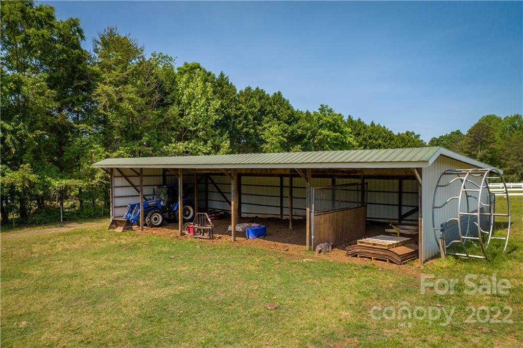 3674 River Road Hickory, NC 28602 - Photo 38 of 48 a view of a backyard with a patio