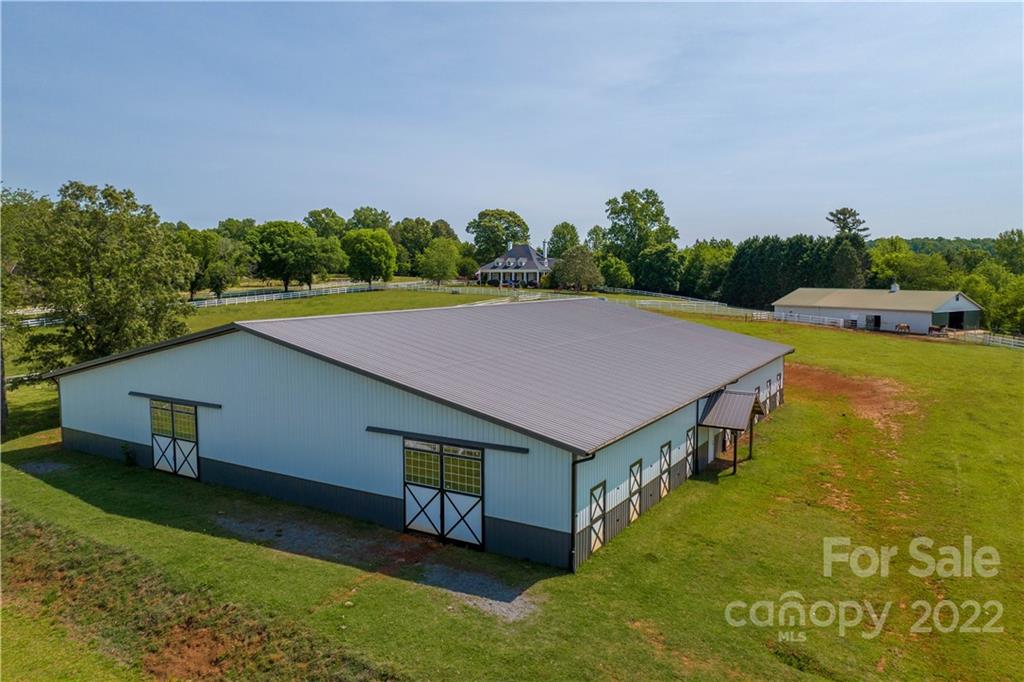 3674 River Road Hickory, NC 28602 - Photo 42 of 48 a aerial view of a house with swimming pool and a yard
