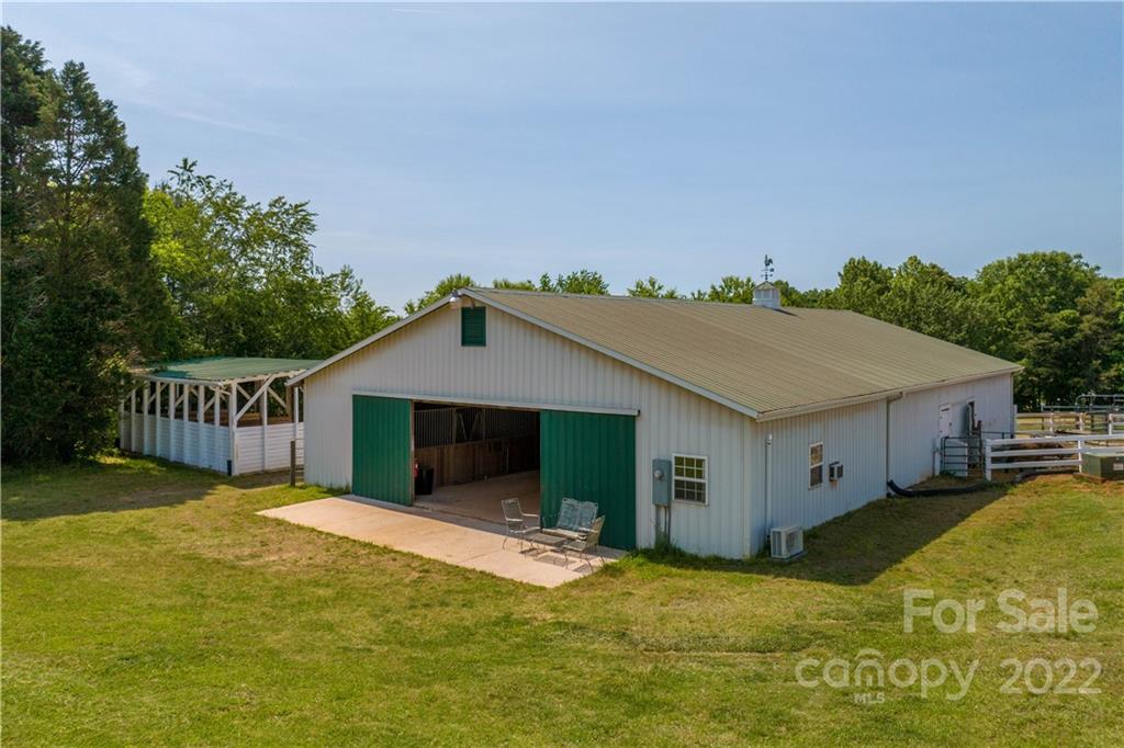 3674 River Road Hickory, NC 28602 - Photo 45 of 48 a view of a house with a yard and deck