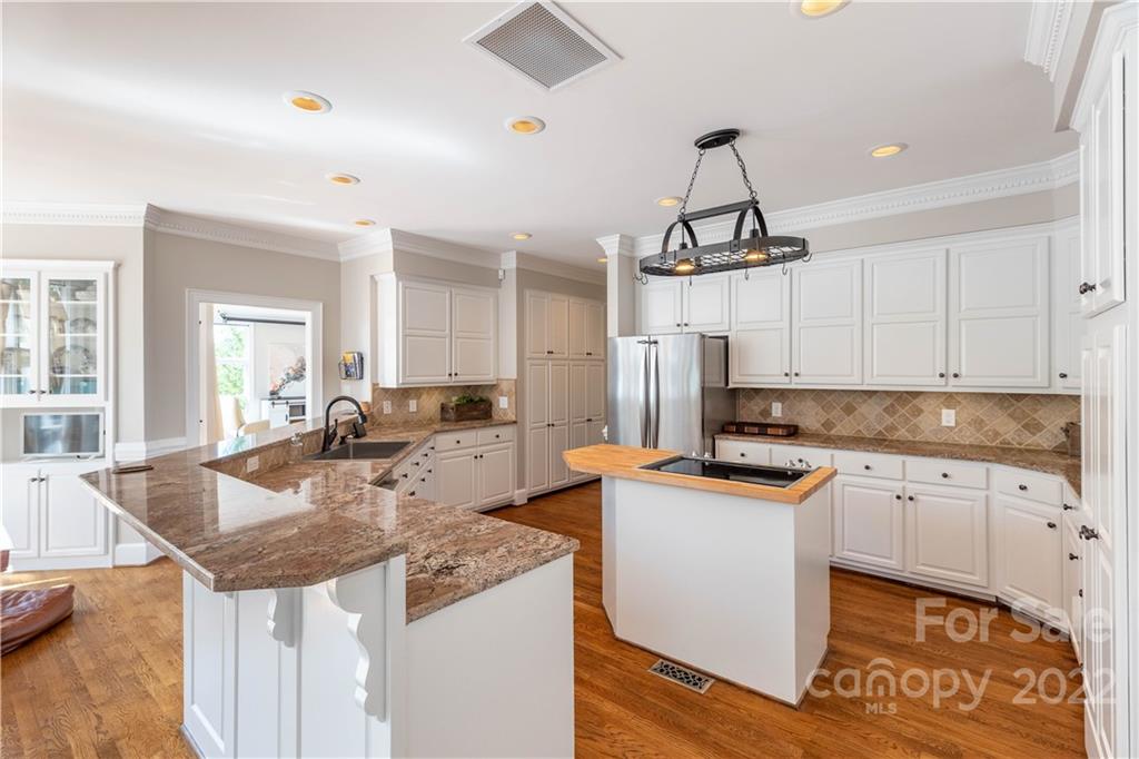 3674 River Road Hickory, NC 28602 - Photo 8 of 48 a kitchen with stainless steel appliances granite countertop a sink stove and refrigerator