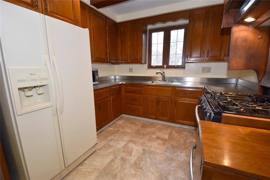 23 Swallow Hill Road Carnegie, PA 15106 - Photo 7 of 24 The well equipped kitchen is ready for the cook in the family. Kitchen is large enough to hold a table and chairs.