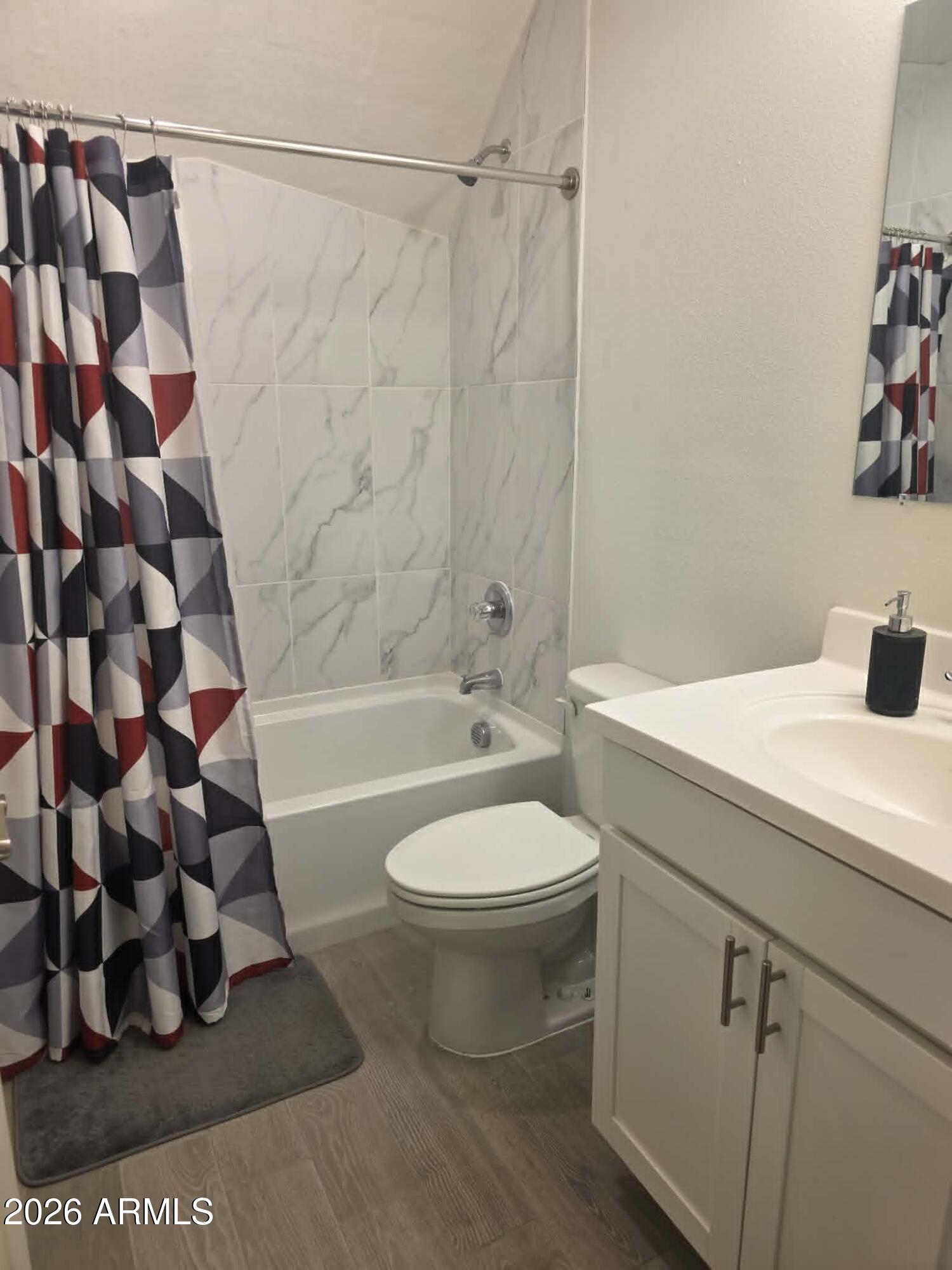 1523 South Warren Road Maricopa, AZ 85139 - Photo 23 of 26 a bathroom with a bathtub and shower