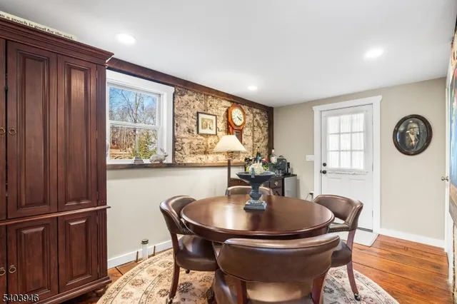a view of a a dining room with furniture window and outside view