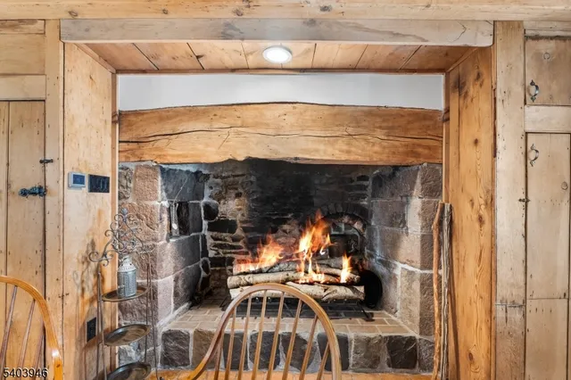 a kitchen with counter top space and wooden floor