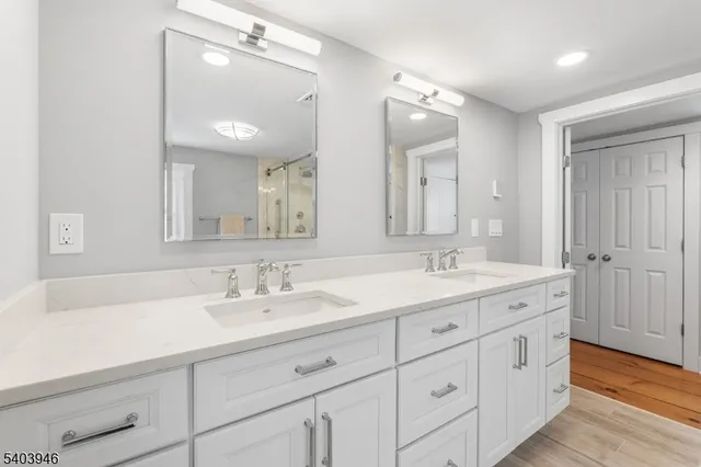 a bedroom with a bed and a lamp