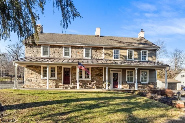a view of a porch with furniture and garden