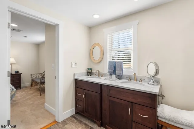 a bedroom with a bed and a lamp