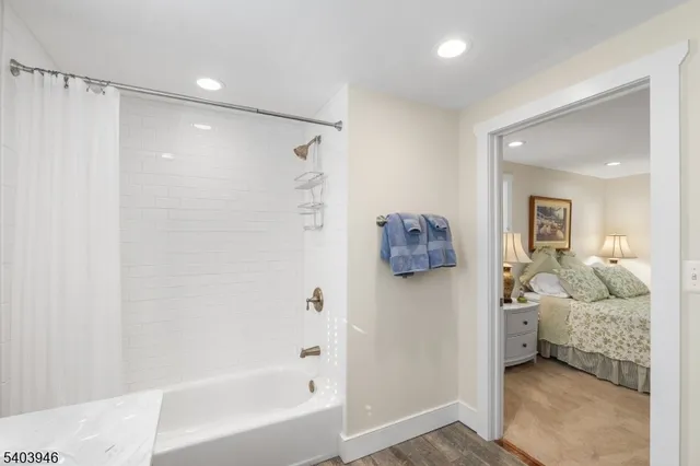 a bedroom with a bed and a table in it