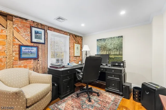 a work room with furniture and a large window