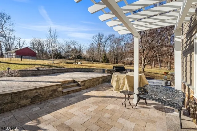 a view of a yard with snow on the tree
