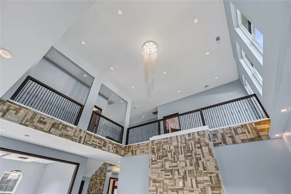 a view of staircase with a ceiling fan