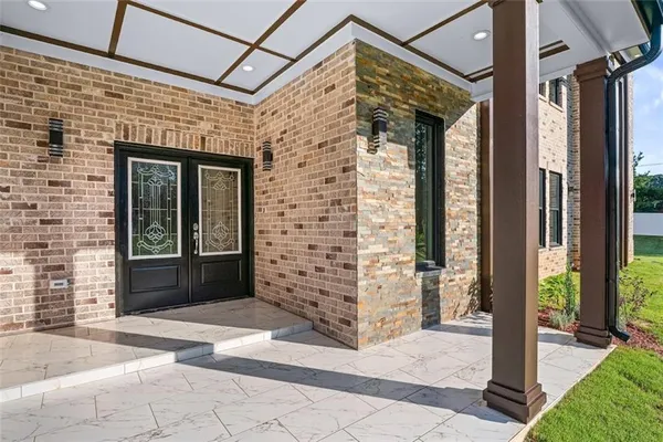 a view of a brick house with a large window