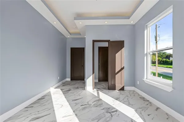 a view of a hallway with windows