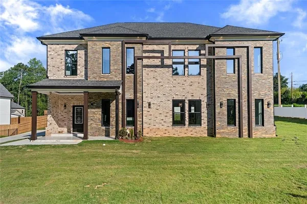 a front view of a house with a yard