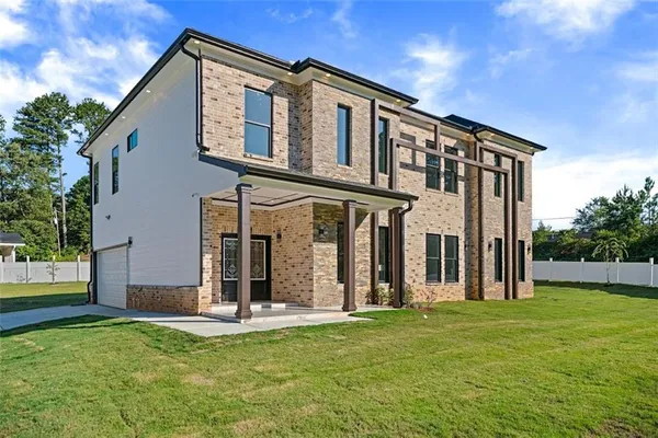 a front view of a house with a yard
