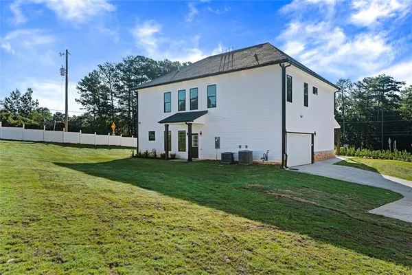 a front view of a house with a yard