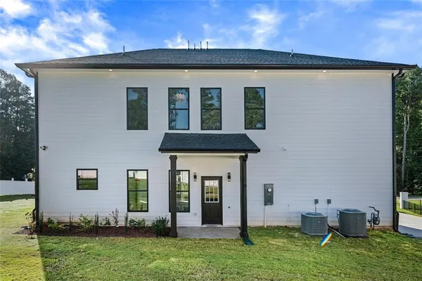 a view of an house with backyard space and garden
